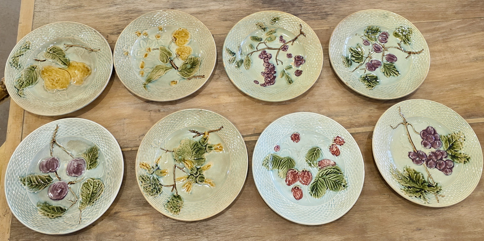 A set of 8 French Majolica Dessert Plates